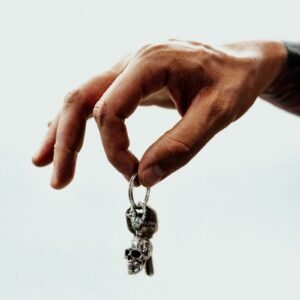 a person holding a small key in their hand